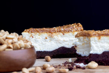 creamy chocolate cake with caramel and roasted peanuts