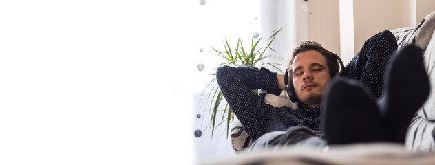 relaxed man at home with headphones