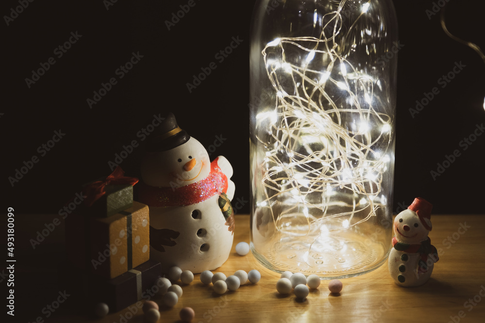 Wall mural home decoration with lights in glass bottles and snowman dolls, gift boxes and santa claus to welcom