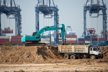loader with container entering the oceanic ferry ship