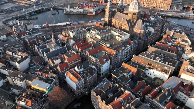 Amsterdam downtown city center central station landmark in The Netherlands. Historic european urban panoramic capital streets canals houses infrastructure and architecture.