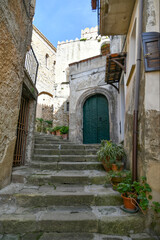 A narrow street among the old stone houses of Castellabate, town in Salerno province, Italy.	
