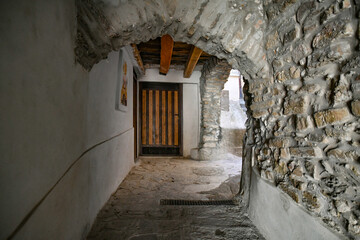 A narrow street among the old stone houses of Castellabate, town in Salerno province, Italy.