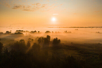 Fototapeta na wymiar amazing sunrise in the countryside over forests and fields in Ukraine