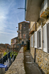 A narrow street among the old stone houses of Castellabate, town in Salerno province, Italy.	