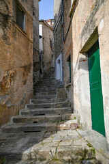 A narrow street among the old stone houses of Castellabate, town in Salerno province, Italy.	