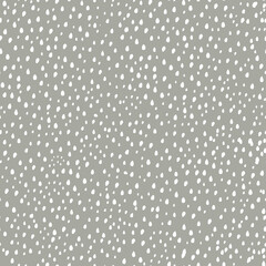 Modern vector pattern with polka dots, small spots. Seamless pattern. Modern design for paper, cover, fabric, decor, print. Gray background light polka dots.