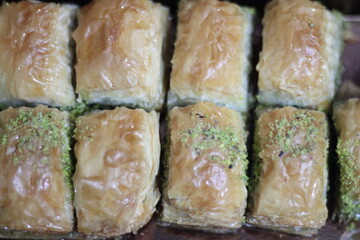 slices of baklava with pistachio wallpaper.