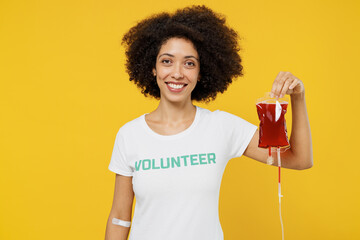 Young fun smiling happy donor woman of African American ethnicity wears white volunteer t-shirt...
