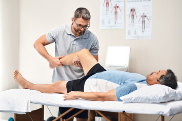 Rehabilitation is a long and important journey to full recovery. Shot of a senior man going through...