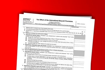Obraz premium Form 5713 (Schedule C) documentation published IRS USA 43199. American tax document on colored