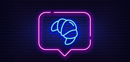 Neon light speech bubble. Croissant line icon. Bakery food sign. Pastry bun symbol. Neon light background. Croissant glow line. Brick wall banner. Vector