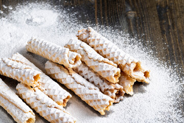 thin crispy waffles lie on a black table