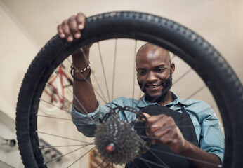 Sometimes, all you need is a new part. Shot of a handsome young man standing alone in his shop and...