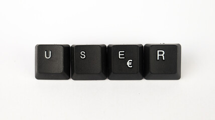 User text created with keyboard keys isolated on white background, white user letters on black keyboard, top view