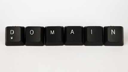 domain text created with keyboard keys, isolated on white background, internet terminology - obrazy, fototapety, plakaty