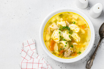 Chicken crock pot  soup with dumplings. Top view, copy space.