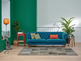 Green and white living room concept, blue sofa orange pillow, middle coffee table, vase of plant, carpet and brown parquet, lamp home decoration style.