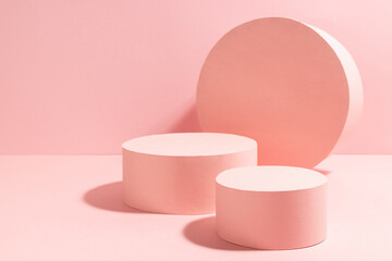 Stylish pastel pink stage mockup with two round podiums, circle decor in sunlight, shadows on contrast background, copy space. Template for advertising, presentation cosmetic product, goods, design.