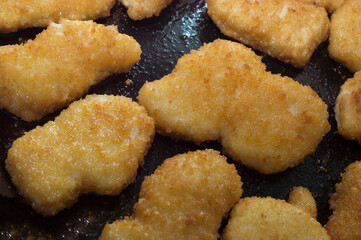 Chicken nuggets in the frying pan