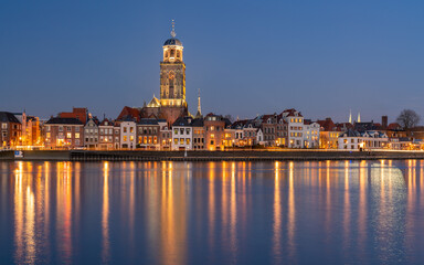 Fototapeta premium Historical city Deventer during blue hour on the shore of river IJssel, Deventer, The Netherlands