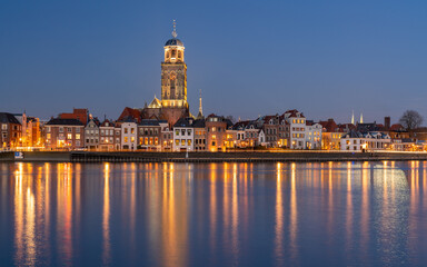 Historical city Deventer during blue hour on the shore of river IJssel, Deventer, The Netherlands