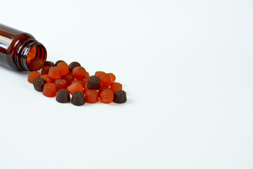 Baby vitamins with a brown bottle close-up and free space for text