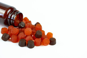 Baby vitamins with berry flavor close-up on a white background