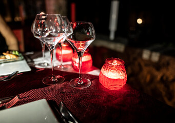 red candles on the dinner table 