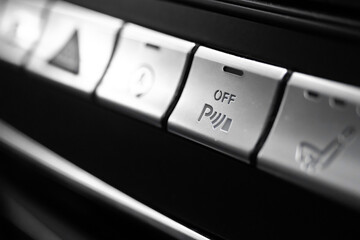 Car parking assist button inside luxury car interior close-up view photo