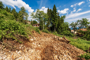 Deforestation and excavation for the construction of new houses in mountain, Italian Alps, Italy,...