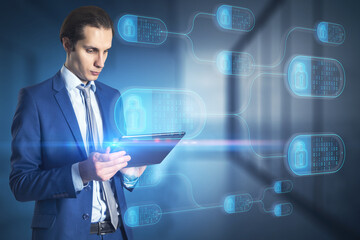 Attractive young european businessman using tablet with abstract big data and security nodes on blurry office interior background. Technology, web safety and programming concept. Double exposure.