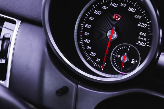 Luxury speedometer in sport car close-up view wallpaper, glowing red indicators