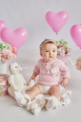Fototapeta premium Valentine Baby girl. Valentine's Day. Balls and flowers. Celebration. Mother's day postcard. International day of happiness. Birthday party