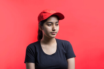 Confident young delivery woman standing isolated on Color Background