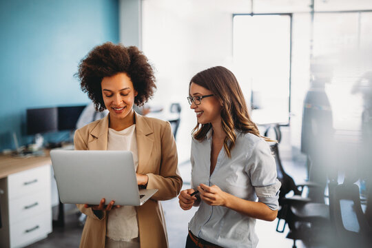 Happy Multiethnic Smiling Business Women Working Together In Office