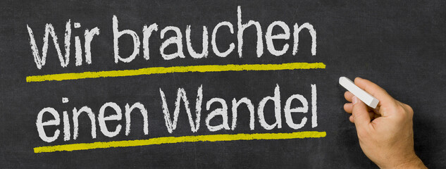 Text auf Tafel - Wir brauchen einen Wandel