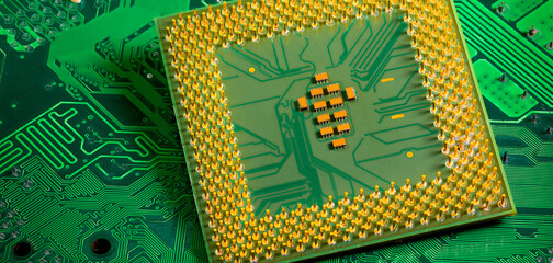 Close up of microchips and pins on Main CPU PC processor circuit board..