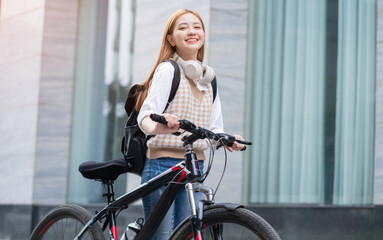 Fototapeta na wymiar Young Asian woman using bicycle as a means of transportation