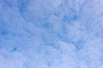 Blue sky and clouds in the form of smoke.