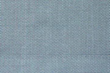 Fototapeta na wymiar Knitted texture. Texture of jacquard fabric with gray blue geometric pattern. Crochet mosaic pattern.