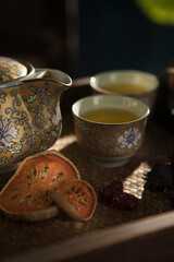 Close up view of nice china teapot and glasses on color back