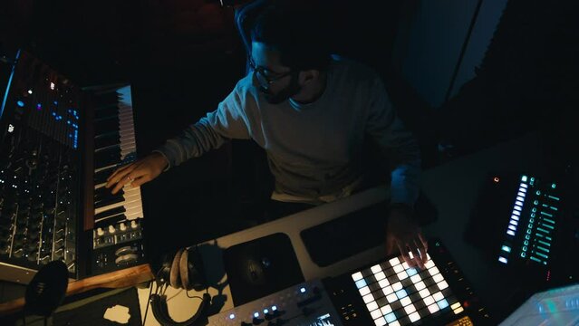 Dj producer is mixing a new music track