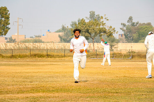 young man player playing cricket