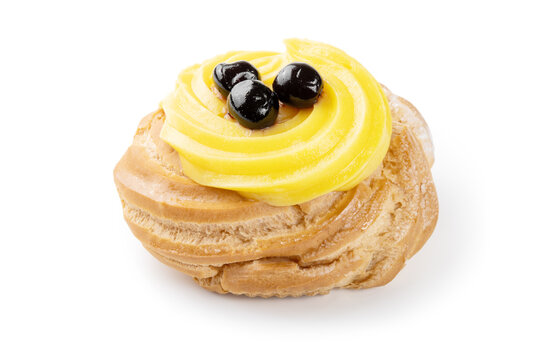 Italian dessert, Zeppola di San Giuseppe, baked cake garnished with custard and sour cherries in syrup, isolated on white background, close-up.