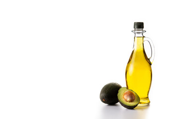 Avocado oil in crystal bottle isolated on white background. Copy space