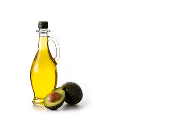 Avocado oil in crystal bottle isolated on white background. Copy space