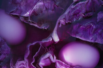 Process of painting Easter eggs with natural dye of red cabbage juice. Easter still life, chicken...