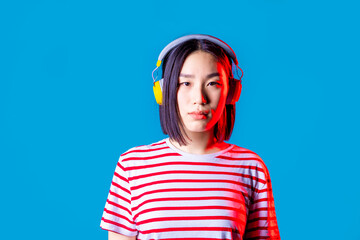 portrait young asiatic woman isolated listening music