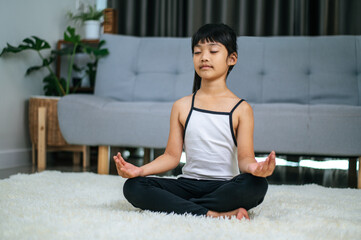 Fototapeta na wymiar girl doing yoga in room on white carpet